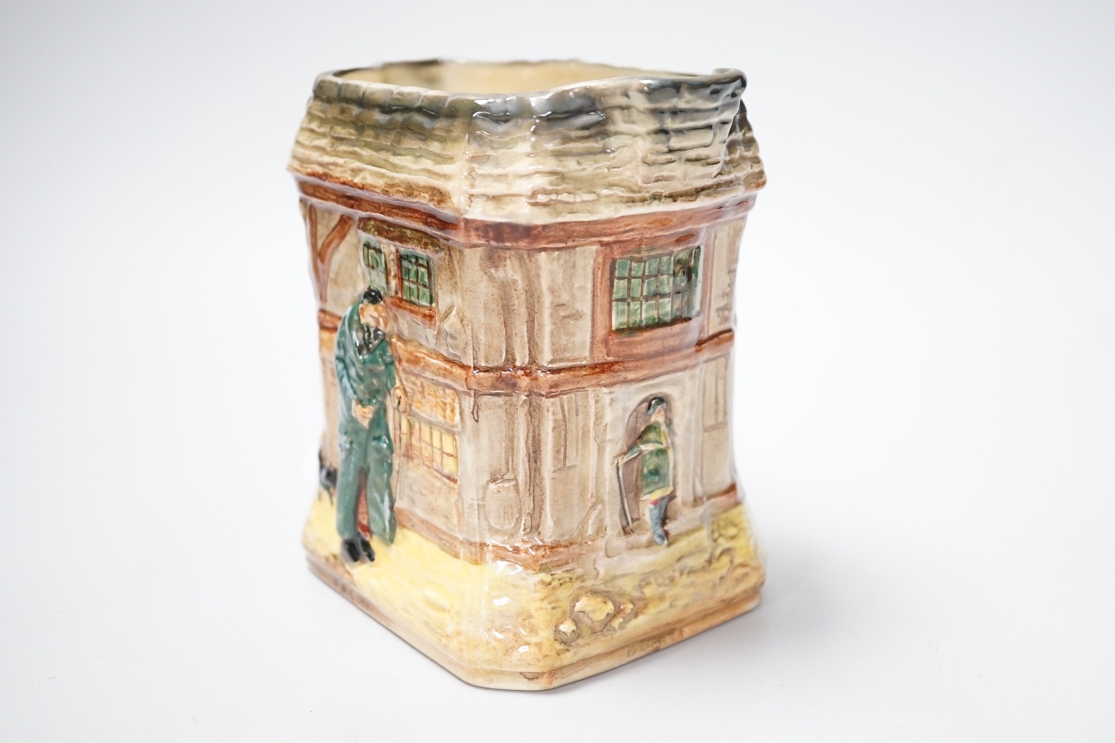 A Doulton Oliver Twist series ware jug and a Pelham puppet